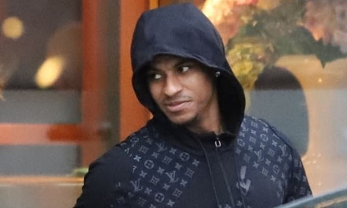 Reported Want-Away Manchester United Striker Marcus Rashford seen leaving Cibo in hale with Ro Shaun Williams and Tyrell Malacia.