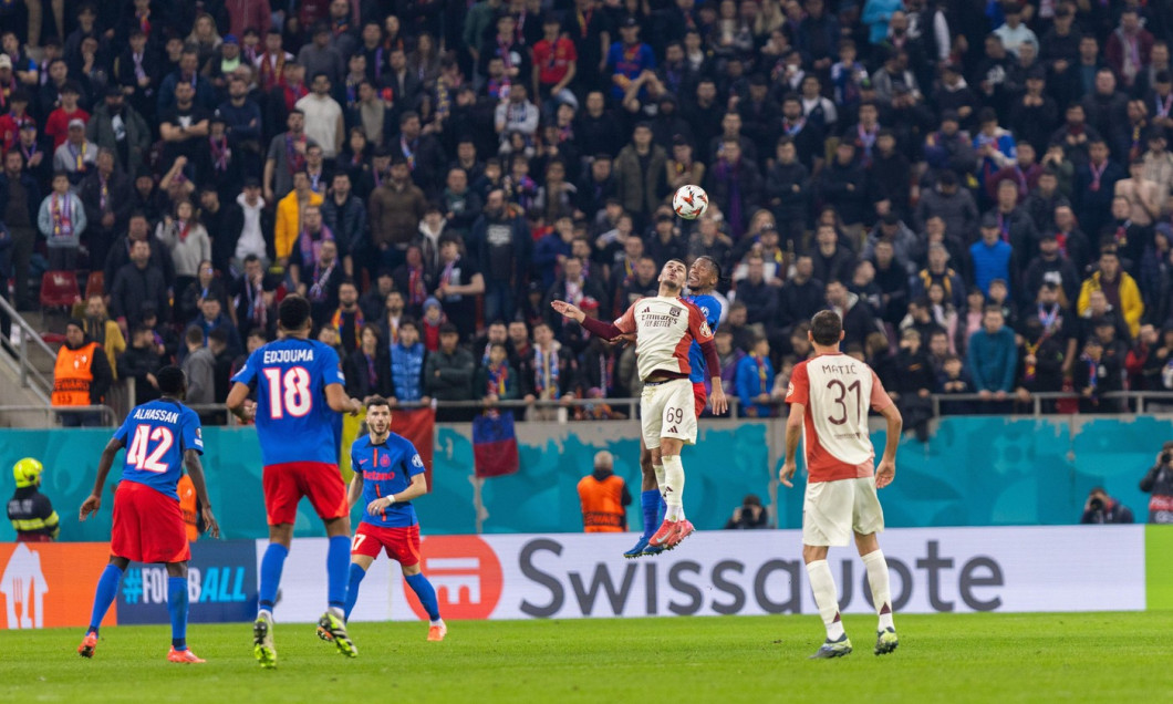 Georges Mikautadze of Lyon and Siyabonga Ngezana of FCSB in action during the UEFA Europa League, Round of 16, 1st leg football match between FCSB and Olympique Lyonnais (Lyon) on 6 March 2025 at National Arena in Bucharest, Romania - Photo Mihnea Tatu /