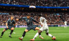 Vinicius Junior of Real Madrid CF and Andrei Ratiu of Rayo Vallecano during the Spanish championship La Liga football match between Real Madrid and Rayo Vallecano on 9 March 2025 at Santiago Bernabeu stadium in Madrid, Spain