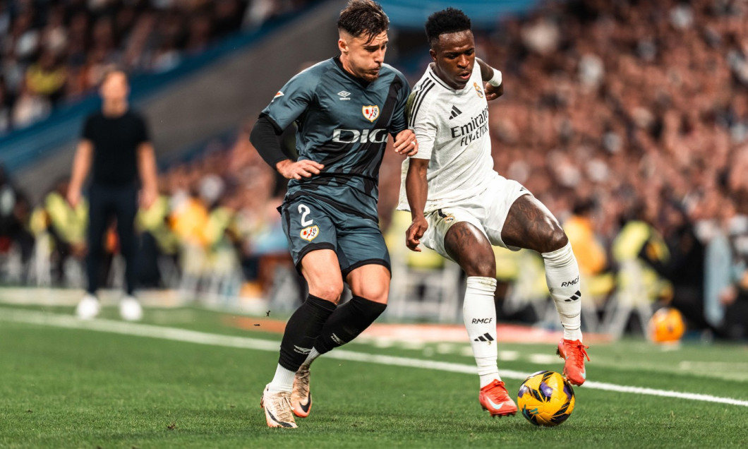 Vinicius Junior of Real Madrid CF and Andrei Ratiu of Rayo Vallecano during the Spanish championship La Liga football match between Real Madrid and Rayo Vallecano on 9 March 2025 at Santiago Bernabeu stadium in Madrid, Spain