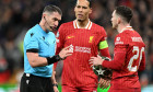 Liverpool, England, 11th March 2025. Referee Istvan Kovacs speaks to Andrew Robertson of Liverpool during the UEFA Champions League match Liverpool vs Paris Saint Germain at Anfield, Liverpool. Picture credit should read: Cody Froggatt / Sportimage