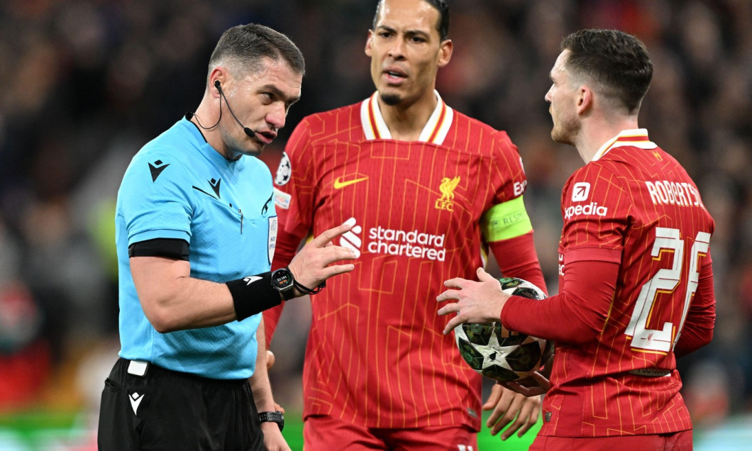 Liverpool, UK. 11th Mar, 2025. Referee Istvan Kovacs speaks to Andrew Robertson of Liverpool during the UEFA Champions League match Liverpool vs Paris Saint Germain at Anfield, Liverpool. Picture credit should read: Cody Froggatt/Sportimage Credit: Sporti