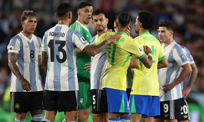 Brazil s forward Raphinha C argues Argentina™s goalkeeper Emiliano Martinez back L during the South American qualificati