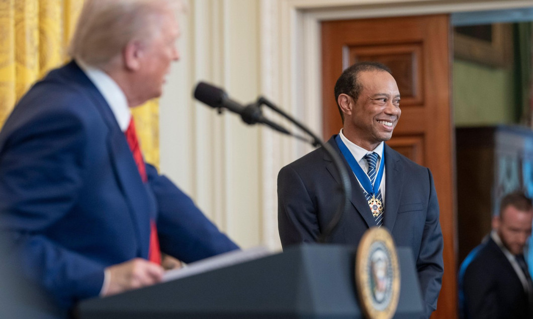 Washington, United States. 20th Feb, 2025. U.S President Donald Trump, left, welcomes golf legend Tiger Woods for Black History Month at the East Room of the White House, February 20, 2025 in Washington, DC. Credit: Daniel Torok/White House Photo/Alamy Li