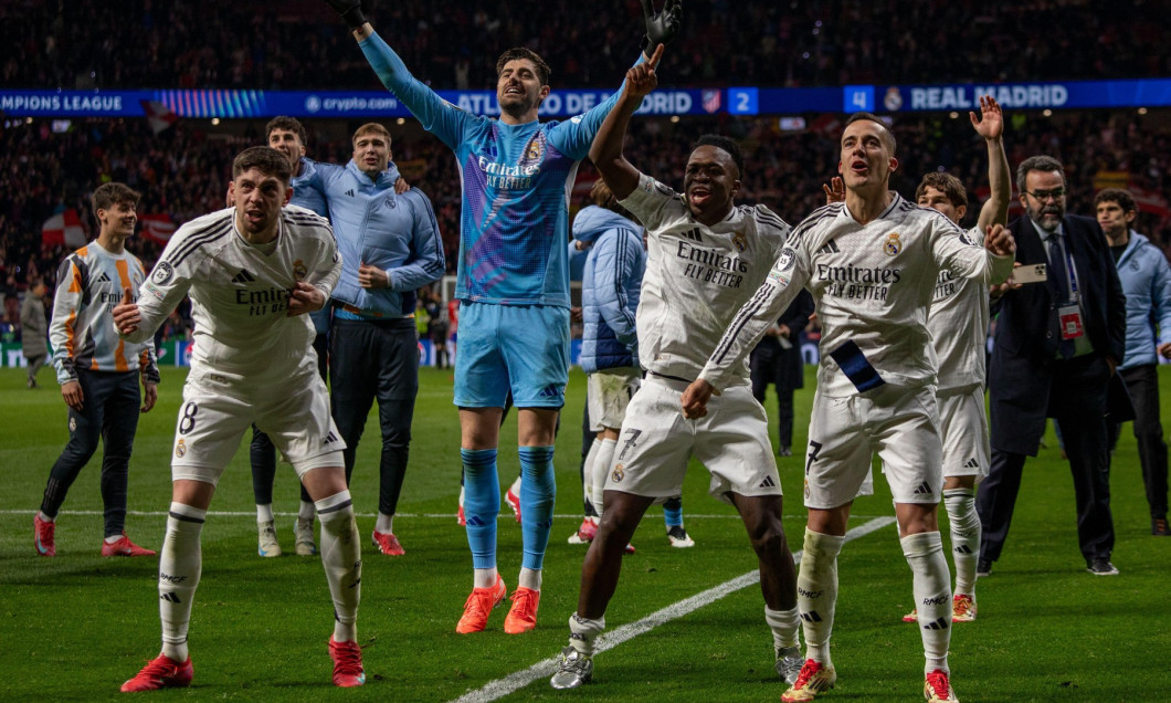 Madrid, Spain. 13th Mar, 2025. From (left to right), Real Madrid's Fede Valverde, Thibaut Courtois, Vinicius Jr., and Lucas Vazquez celebrate during the second leg of the UEFA Champions League round of 16 between Atlético de Madrid and Real Madrid at the