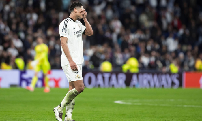 MADRID, SPAIN - April 16: Jude Bellingham of Real Madrid reacts to a lost match at the endo of the UEFA Champions League 2024/25 Quarter Final second Leg match between Real Madrid and Arsenal at Santiago Bernabeu Stadium. (Photo by Guillermo Martinez)