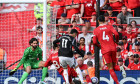 Liverpool, England, 11th May 2025. Conor Bradley of Liverpool blocks a shot from Gabriel Martinelli of Arsenal during the Liverpool vs Arsenal Premier League match at Anfield, Liverpool. Picture credit should read: Cody Froggatt / Sportimage