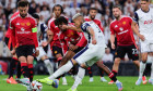 Richarlison de Andrade of Tottenham Hotspur, challenged by Bruno Fernandes and Patrich Dorgu of Manchester United, in action during the 2024/2025 Europa League Final football match between Tottenham Hotspur and Manchester United at San Mames stadium in Bi
