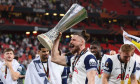 BILBAO, SPAIN - 21st May 2025: Radu Dragusin of Tottenham Hotspur celebrates with the trophy after the UEFA Europa League Final between Tottenham Hotspur FC and Manchester United FC at San Mames Stadium (Credit: Craig Mercer/ Alamy Live News)