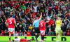 Referee Thomas Bramall red card Aston Villa goalkeeper Emiliano Martínez (23) could on Manchester United forward Rasmus Hojlund (9) during the Manchester United FC v Aston Villa FC English Premier League match at Old Trafford, Manchester, England, Unite
