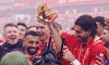 Liverpool's Mohamed Salah (left) and Dominik Szoboszlai celebrate with the Premier League trophy after the Premier League match at Anfield, Liverpool. Picture date: Sunday May 25, 2025.