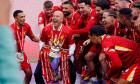 Liverpool manager Arne Slot lifts the Premier League trophy with the players after the Premier League match at Anfield, Liverpool. Picture date: Sunday May 25, 2025.