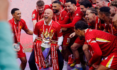 Liverpool manager Arne Slot lifts the Premier League trophy with the players after the Premier League match at Anfield, Liverpool. Picture date: Sunday May 25, 2025.