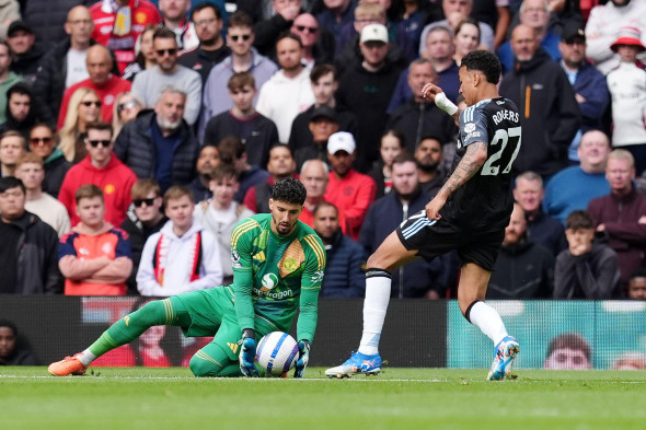 Aston Villa's Morgan Rogers (right) kicks the ball away from Manchester United goalkeeper Altay Bayindir before scoring only for the goal to be disallowed by referee Thomas Bramall during the Premier League match at Old Trafford, Manchester. Picture date: