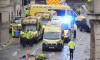 Police and emergency personnel dealing with a road traffic accident on Water Street near the Liver Building in Liverpool after a car collided with pedestrians during the Premier League winners parade. A man has been detained. Picture date: Monday May 26,