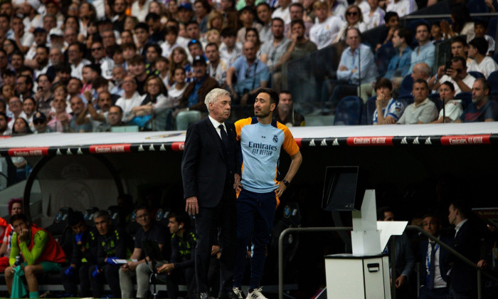 Madrid, Spain. 24th May, 2025. Carlo Ancelotti (L) Real Madrid manager, and his son Davide Ancelotti (R) seen in action during the EA SPORTS La Liga match between Real Madrid and Real Sociedad at the Santiago Bernabéu Stadium. Final score: Real Madrid 2:0