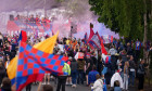 Fans of south London football club Crystal Palace watch team buses pass-by after their club’s historic FA cup victory, around their Selhurst Park ground, on 26th May 2025, in London, England. ‘The Eagles’ beat Manchester 1-0 at Wembley last week marking t