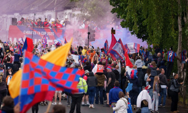 Fans of south London football club Crystal Palace watch team buses pass-by after their club’s historic FA cup victory, around their Selhurst Park ground, on 26th May 2025, in London, England. ‘The Eagles’ beat Manchester 1-0 at Wembley last week marking t