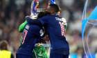 Paris Saint Germain's Ferreira Vitinha and Ousmane Dembele with the Champions League trophy following the UEFA Champions League final at the Munich Football Arena, Munich, Germany. Picture date: Saturday May 31, 2025.