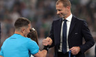 Munich, Germany. 31st May, 2025. UEFA President Aleksander Ceferin shakes hands with the Referee Istvan kovacs of Romania during the medals ceremony following the Paris Saint Germain vs Internazionale UEFA Champions League Final match at Munich Football A