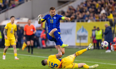 Andrei Burca of Romania and Edin Dzeko of Bosnia and Herzegovina in action during the FIFA World Cup 2026, Qualifiers, Group H football match between Romania and Bosnia-Herzegovina on 21 March 2025 at National Arena in Bucharest, Romania - Photo Mihnea Ta