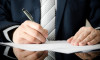 Businessman signs a contract. man contract signing hand writing pen letter paper concept