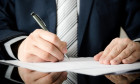 Businessman signs a contract. man contract signing hand writing pen letter paper concept