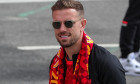 Jordan Henderson #14 of Liverpool arrives for the open top bus parade