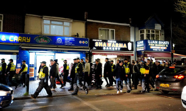 Police escort fans to the stadium ahead of the Sky Bet Championship match at Kenilworth Road, Luton. Picture date: Tuesday February 28, 2023.