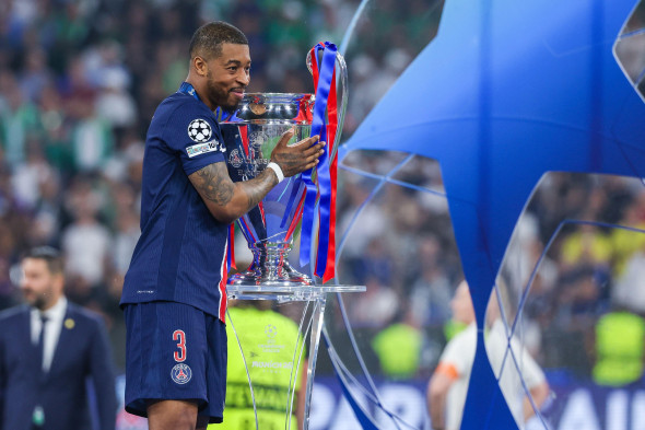 Munich, Germany. 02nd June, 2025. Presnel Kimpembe of Paris Saint-Germain FC with the trophy during UEFA Champions League 2024/25 Final football match between Paris Saint-Germain FC and FC Internazionale at Munich Football Arena Credit: Independent Photo