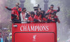 Liverpool's Mohamed Salah (left), Kostas Tsimikas (second left) Dominik Szoboszlai, goalkeeper Alisson Becker (centre right) and team-mates on the team bus during the Premier League winners parade in Liverpool. Liverpool secured their second title in 35 y
