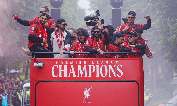Liverpool's Mohamed Salah (left), Kostas Tsimikas (second left) Dominik Szoboszlai, goalkeeper Alisson Becker (centre right) and team-mates on the team bus during the Premier League winners parade in Liverpool. Liverpool secured their second title in 35 y