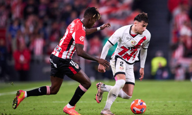 Andrei Ratiu of Rayo Vallecano duels for the ball with Nico Williams of Athletic Club during the LaLiga EA Sports match between Athletic Club and Rayo