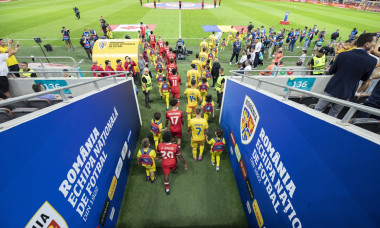 Romania and Canada teams enter the stadium