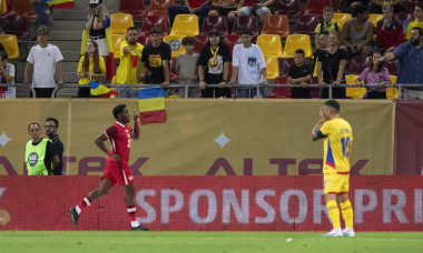 20 Jonathan David celebrates his team's first goal and 10 Nicolae Stanciu has his face coverd by hands