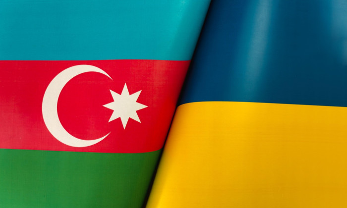 Flags of the ukraine and azerbaijan. The concept of international relations between countries. The concept of an alliance or a confrontation between t