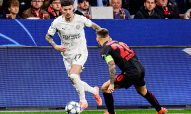 Dennis Man of PSV Eindhoven battles for possession with Alejandro Grimaldo of Bayer 04 Leverkusen during the UEFA Champions League 2025/26 League Phase MD2 match between Bayer 04 Leverkusen and PSV Eindhoven at BayArena on October 1, 2025 in Leverkusen, G