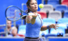 WUHAN, CHINA - OCTOBER 07: Emma Raducanu of Great Britain returns a shot in the Women s Singles Round of 64 match agains