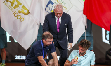 SHANGHAI, CHINA - OCTOBER 12: Arthur Rinderknech of France feels unwell during the award ceremony after his match against Valentin Vacherot of Monaco on day 14 of the 2025 Shanghai Rolex Masters at Qi Zhong Tennis Center on October 12, 2025 in Shanghai, C