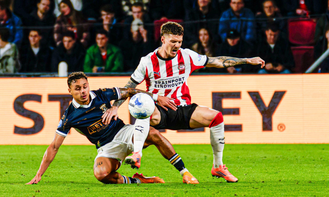 Dennis Man of PSV Eindhoven battles for possession with Dean James of Go Ahead Eagles during the Dutch Eredivisie match between PSV Eindhoven and Go Ahead Eagles at Philips Stadion on October 18, 2025 in Eindhoven, Netherlands. (Credit: Kevin Senders/MTB-