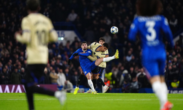 Chelsea's Pedro Neto and Barcelona's Ronald Araujo battle for the ball during the UEFA Champions League, league phase match at Stamford Bridge, London. Picture date: Tuesday November 25, 2025.