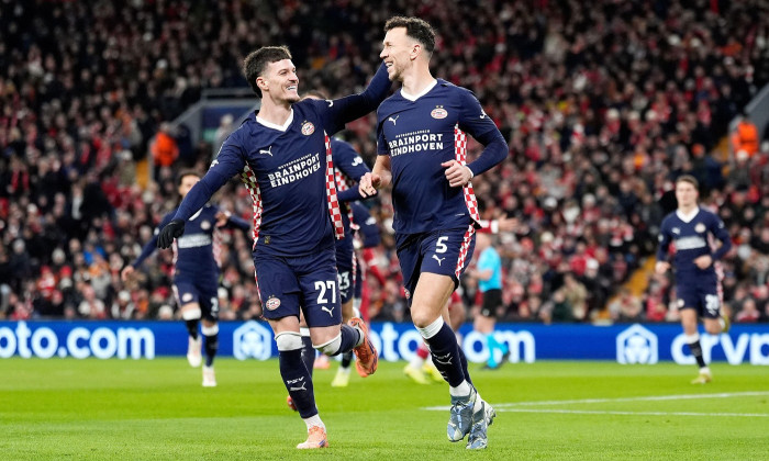 PSV Eindhoven's Ivan Perisic (right) celebrates scoring their side's first goal from a penalty with Dennis Man during the UEFA Champions League, league phase match at Anfield, Liverpool. Picture date: Wednesday November 26, 2025.