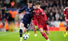 PSV Eindhoven's Dennis Man (left) and Liverpool's Milos Kerkez battle for the ball during the UEFA Champions League, league phase match at Anfield, Liverpool. Picture date: Wednesday November 26, 2025.
