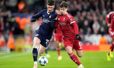 PSV Eindhoven's Dennis Man (left) and Liverpool's Milos Kerkez battle for the ball during the UEFA Champions League, league phase match at Anfield, Liverpool. Picture date: Wednesday November 26, 2025.