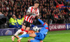 EINDHOVEN, NETHERLANDS - DECEMBER 9: Dennis Man of PSV Eindhoven battles for possession with Nicolas Gonzalez of Atletico Madrid during the UEFA Champions League 2025/26 League Phase MD6 match between PSV Eindhoven and Atletico Madrid at Phillips Stadion