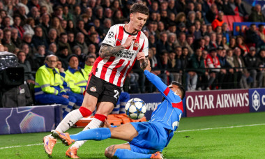 EINDHOVEN, NETHERLANDS - DECEMBER 9: Dennis Man of PSV Eindhoven battles for possession with Nicolas Gonzalez of Atletico Madrid during the UEFA Champions League 2025/26 League Phase MD6 match between PSV Eindhoven and Atletico Madrid at Phillips Stadion