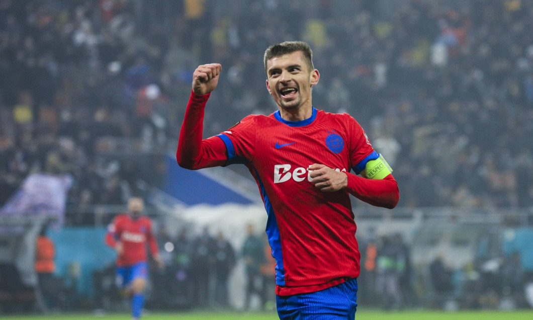 10 Florin Tanase celebrates scoring his first goal of the matchand winning the match