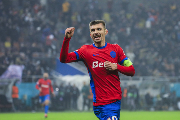 10 Florin Tanase celebrates scoring his first goal of the matchand winning the match