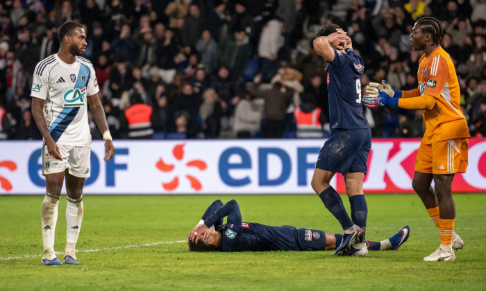 Paris, France. 13th Jan, 2026. Paris Saint-Germain's French midfielder #14 Desire Doue reacts on the ground after losing the French Cup round of 32 football match between Paris Saint-Germain (PSG) and Paris FC at the Parc des Princes stadium in Paris on J