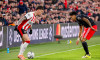 Dennis Man of PSV Eindhoven dribbles with the ball under pressure from Luis Diaz of FC Bayern Munchen during the UEFA Champions League 2025/26 League Phase MD8 match between PSV Eindhoven and FC Bayern Munchen at PSV Stadion on January 28, 2026 in Eindhov